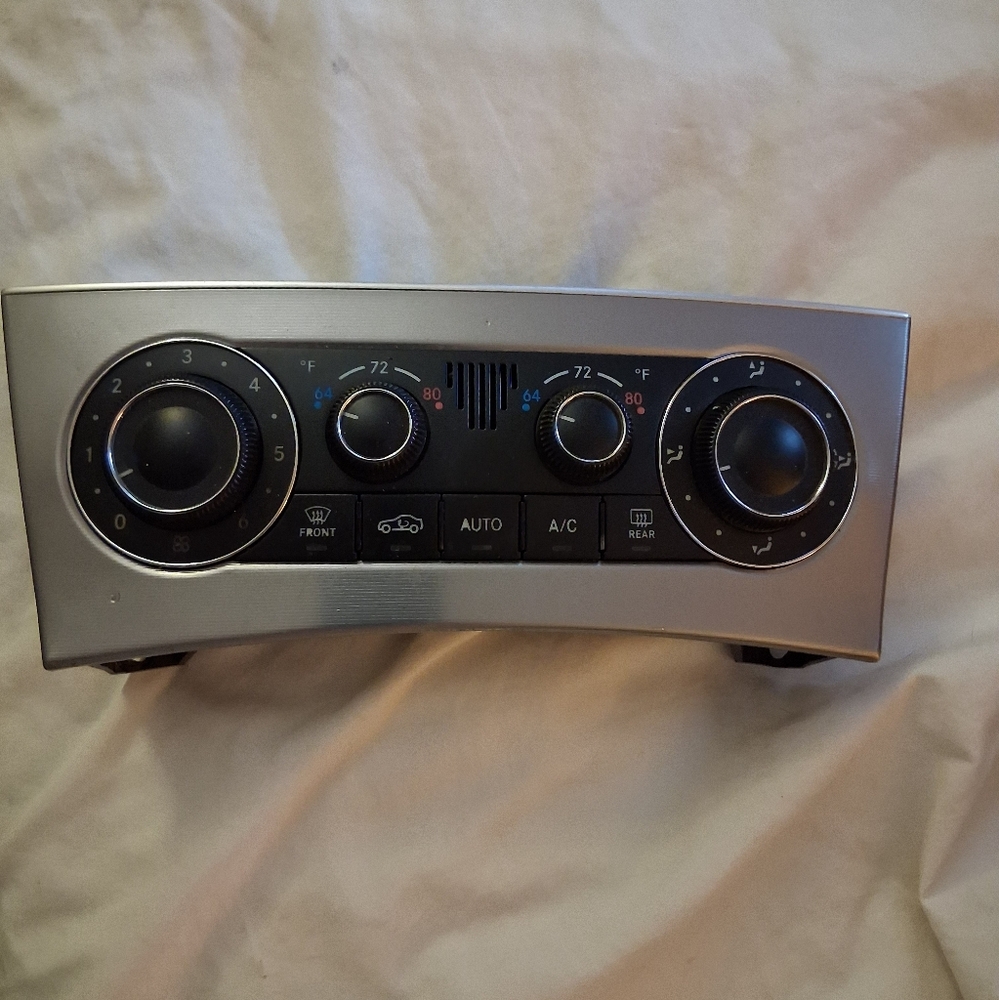 Silver and Black Mercedes C230 AC Control Panel with Illuminated Knobs